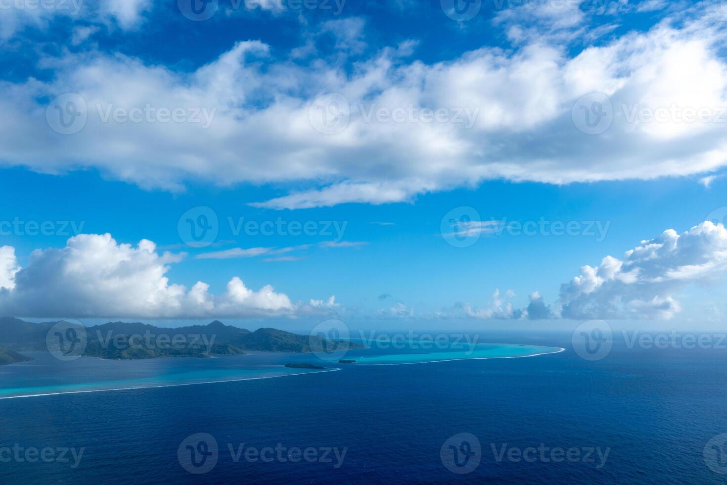 Aerial view of Tahaa island, French Polynesia, with turquoise lagoon and reef photo