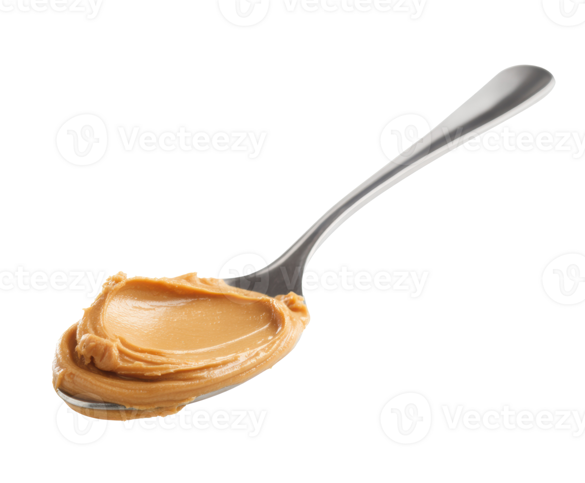 Creamy peanut butter on a spoon ready for a tasty snack or recipe png