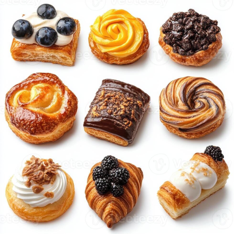 Assorted Variety of Fresh Delicious Small Pastries and Croissants Including Fruit Tarts Chocolate Filled and Cream Filled Mini Cakes for Dessert photo