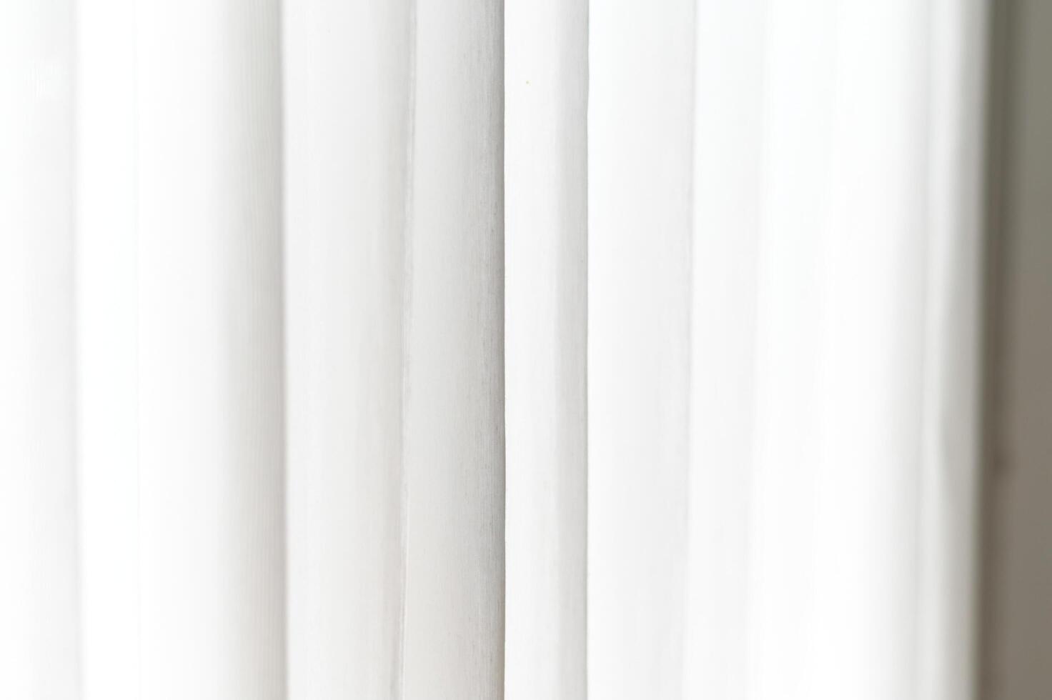 White light and soft subtle shadow create gentle vertical gradient texture, forming clean background. minimal pattern plain surface shows elegant lines and curves, providing simple decor photo