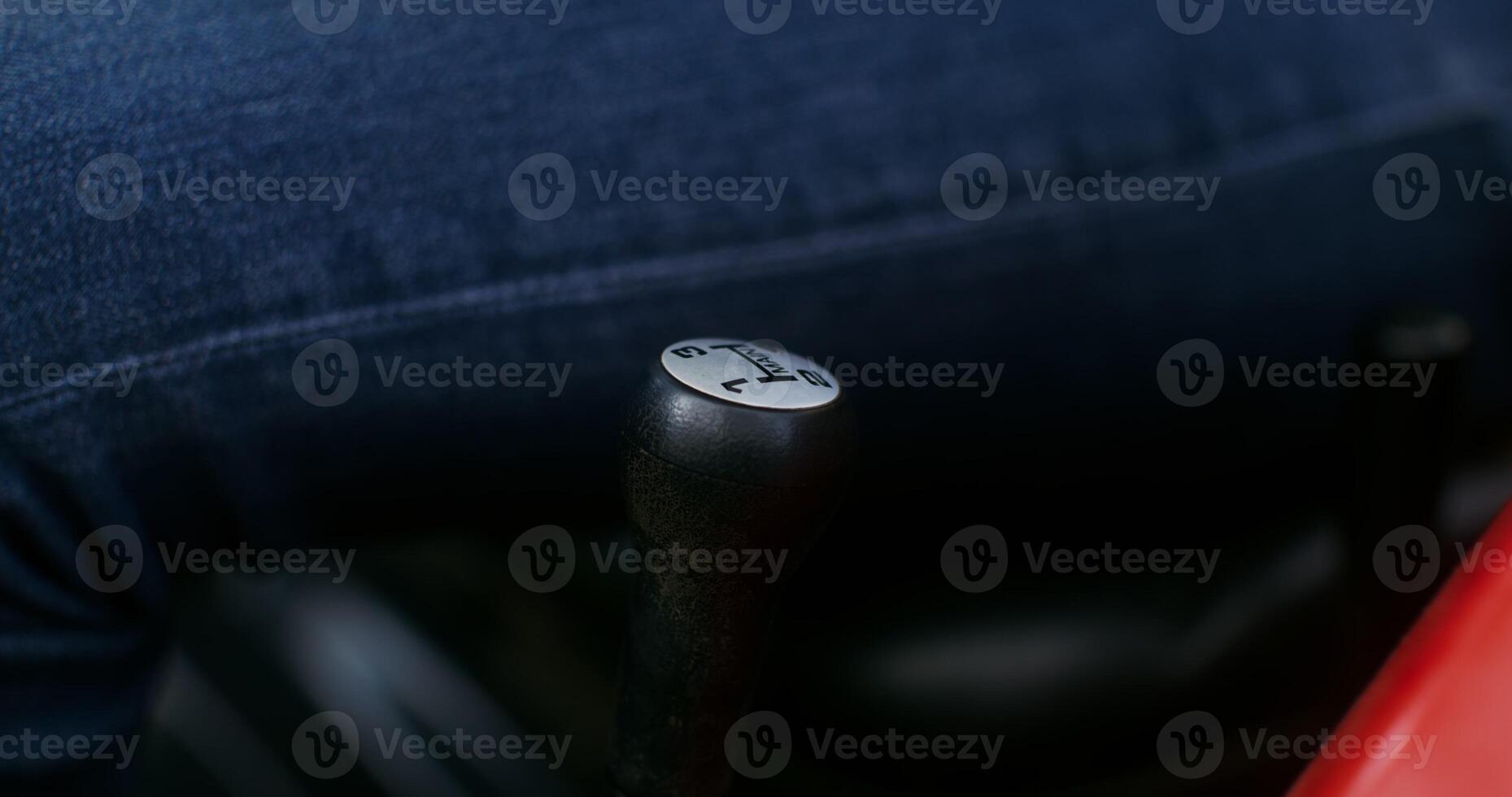 Close up of a male hairy hand shifting the gear lever of a modern agricultural machine, a man's face is not in the frame, an unrecognizable person photo