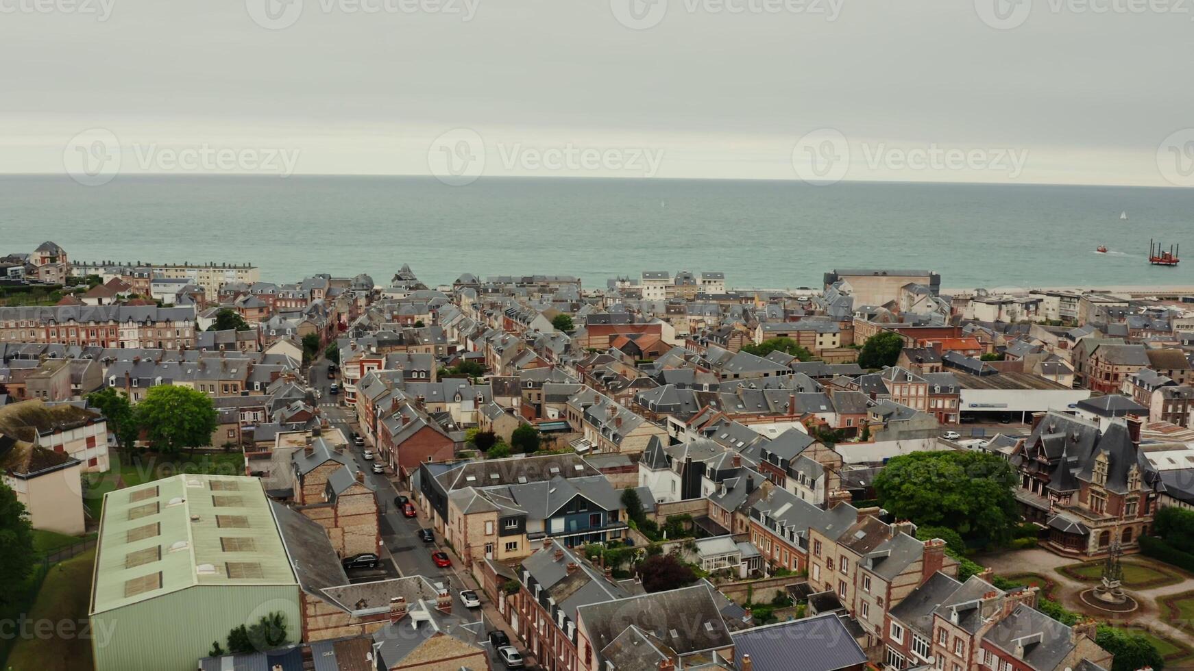 Drone of an old low rise town with traditional houses located on the banks of the English Channel in northern France, filmed on a sunny summer day photo