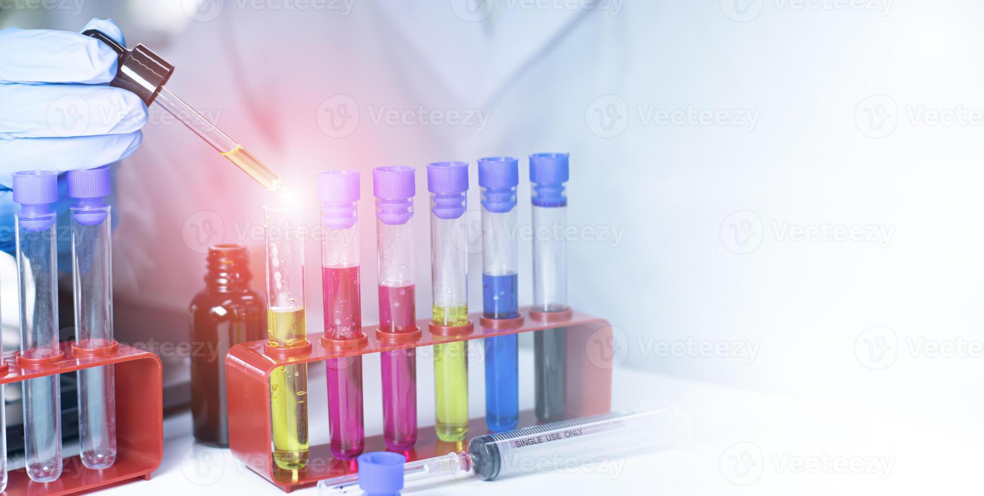 Scientist doing chemical experiment in laboratory with flask of liquid. Concept of science research, chemistry study and laboratory investigation. photo