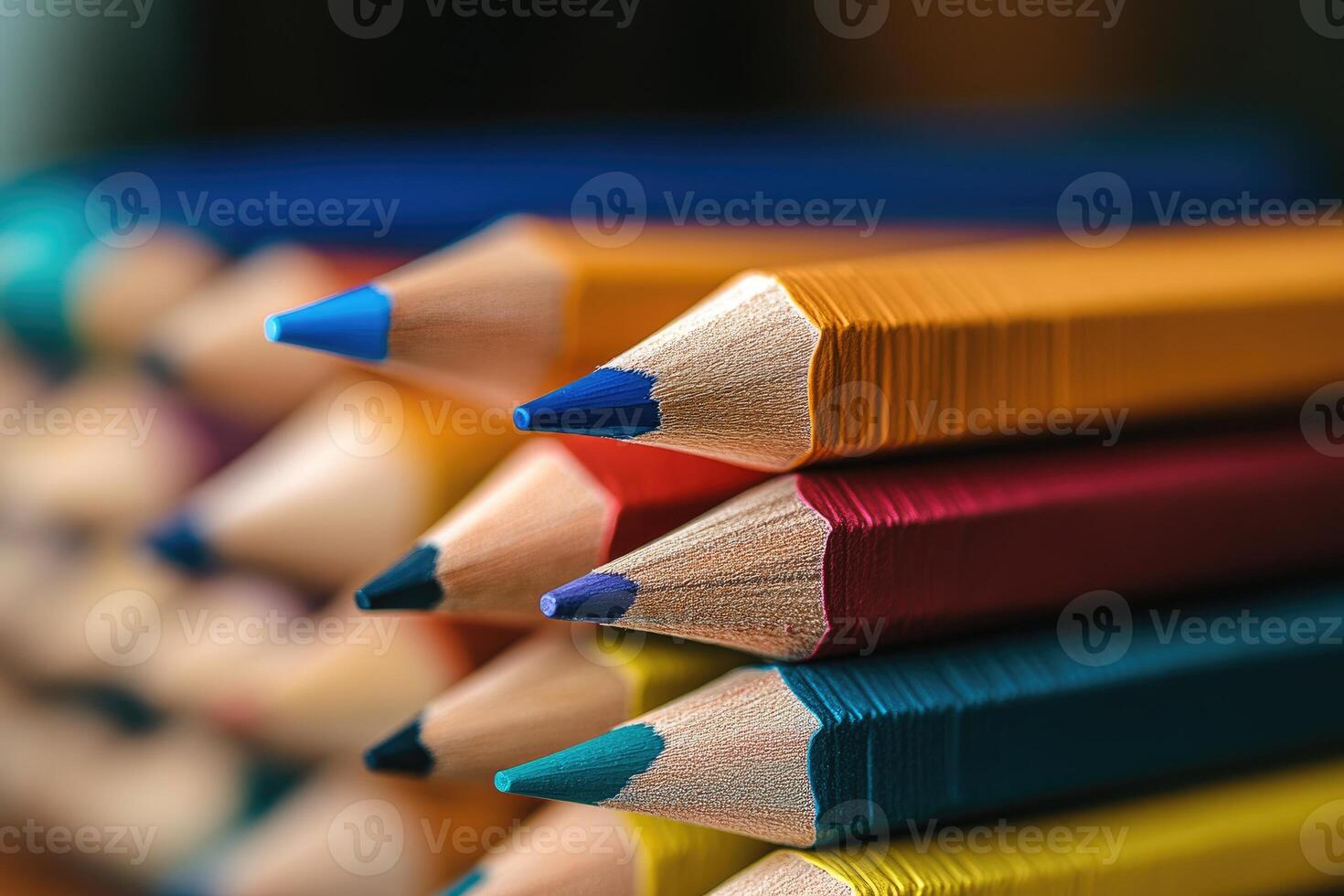 Close-up of stacked colored pencils showing sharpened tips photo