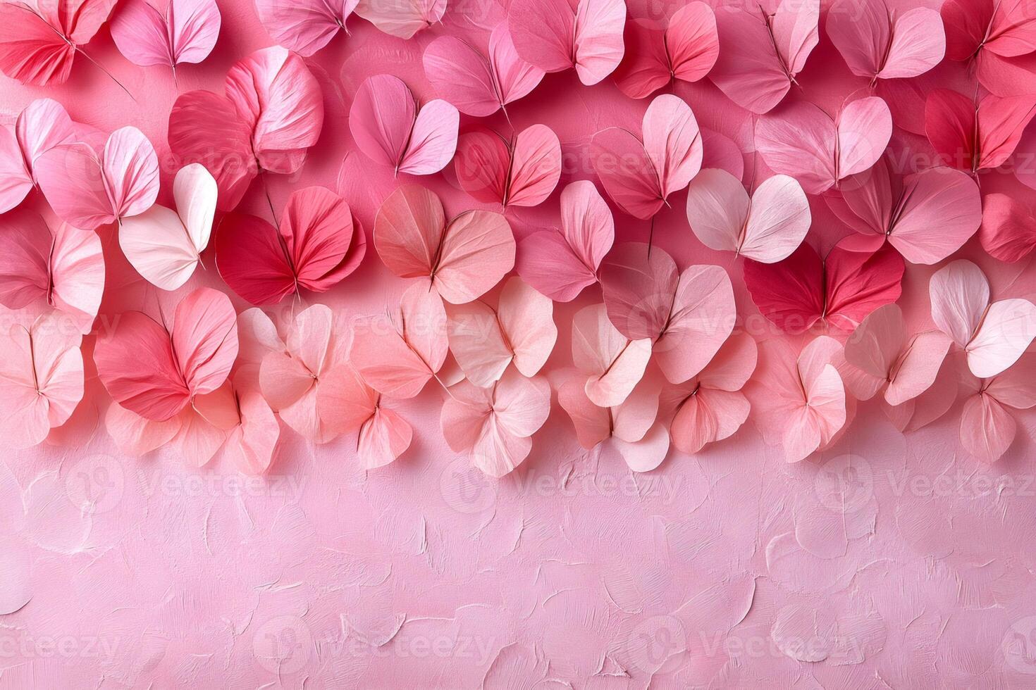 Pink paper leaves arranged on pink background creating beautiful pattern photo