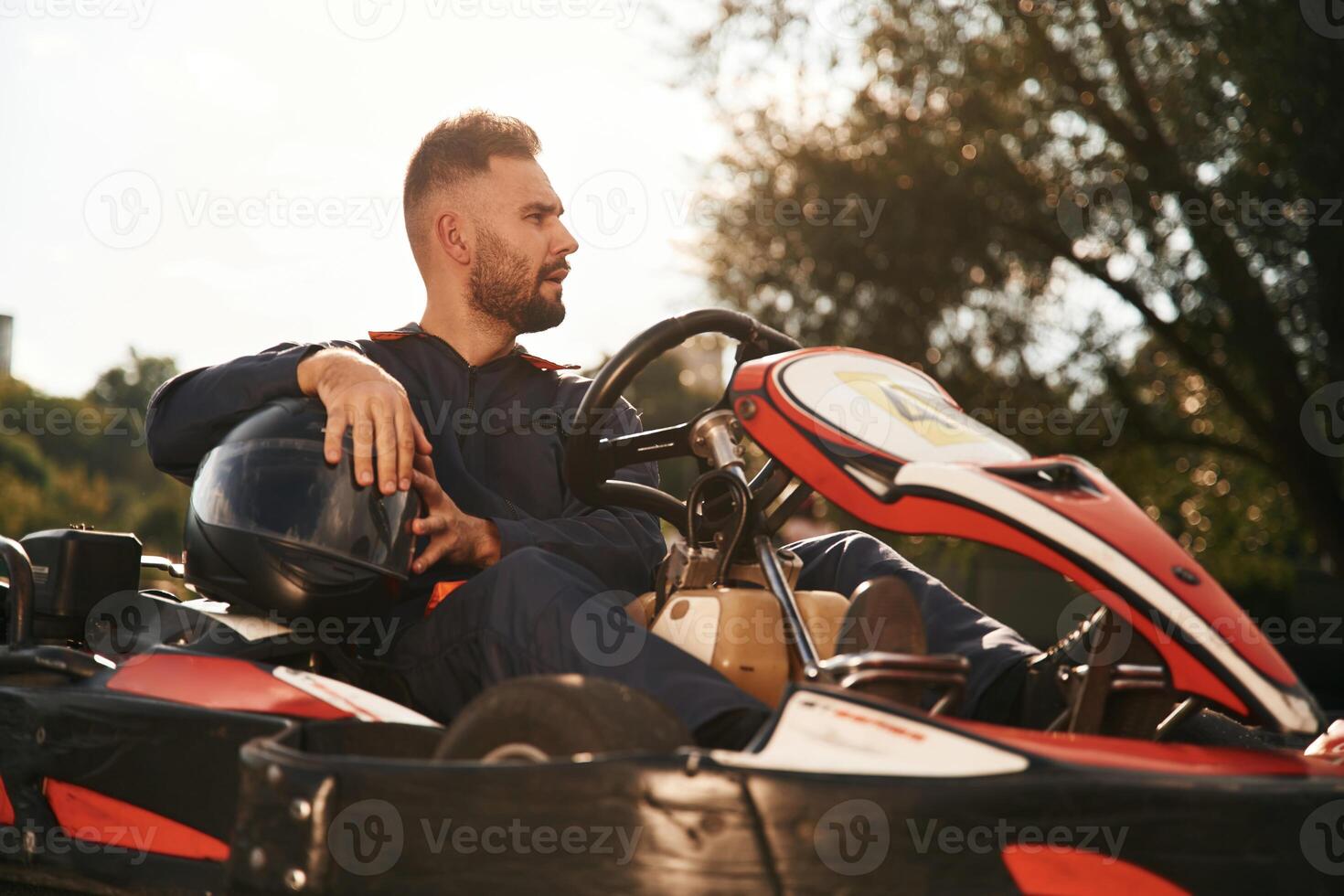 Wellness, free time. Man ,,is outdoors, kart racing conception photo