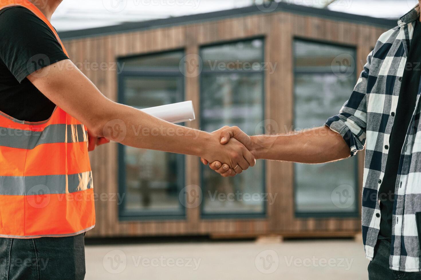 Agreement,, handshake. Two workers ,are,, in the industrial wooden warehouse photo