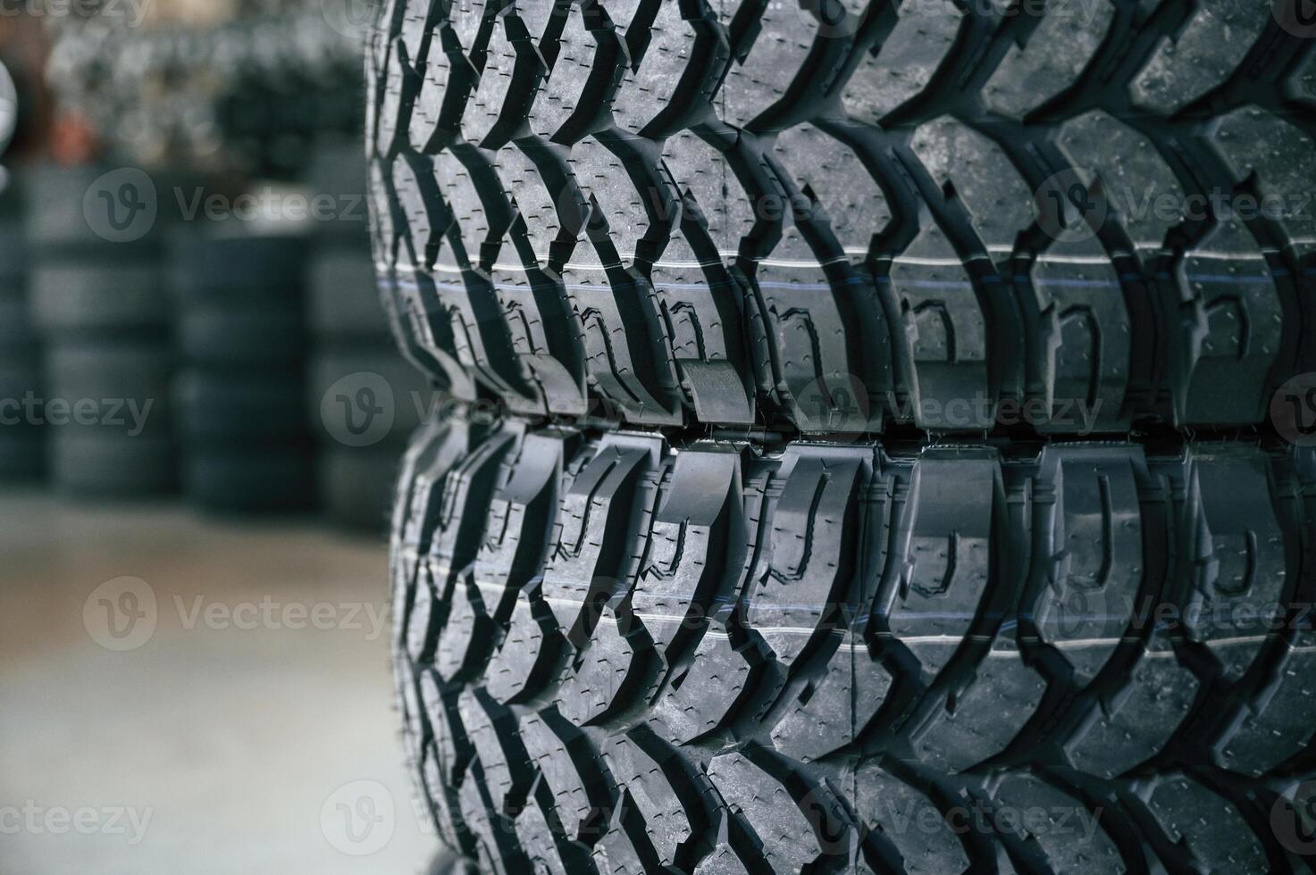 New tires are placed on the storage rack i,,n the car workshop photo