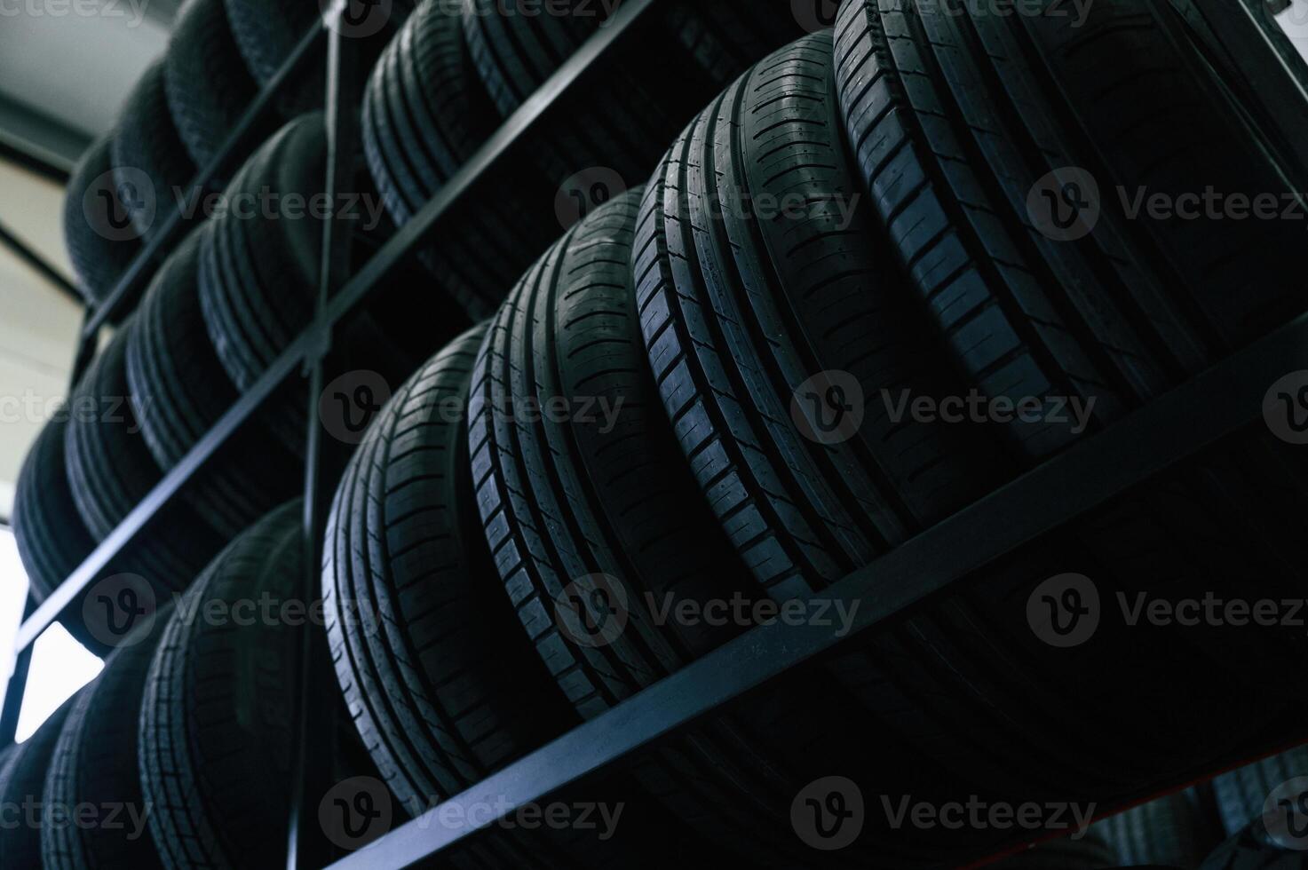 On the shelves. New,, tires ,are placed on the storage rack in the car workshop photo