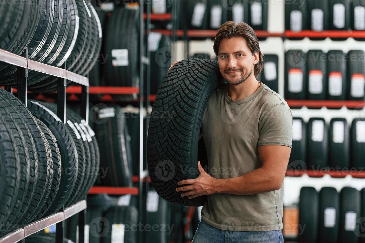 Customer is choosing the tire. Man, is ,in ,the, tire fitting car service photo