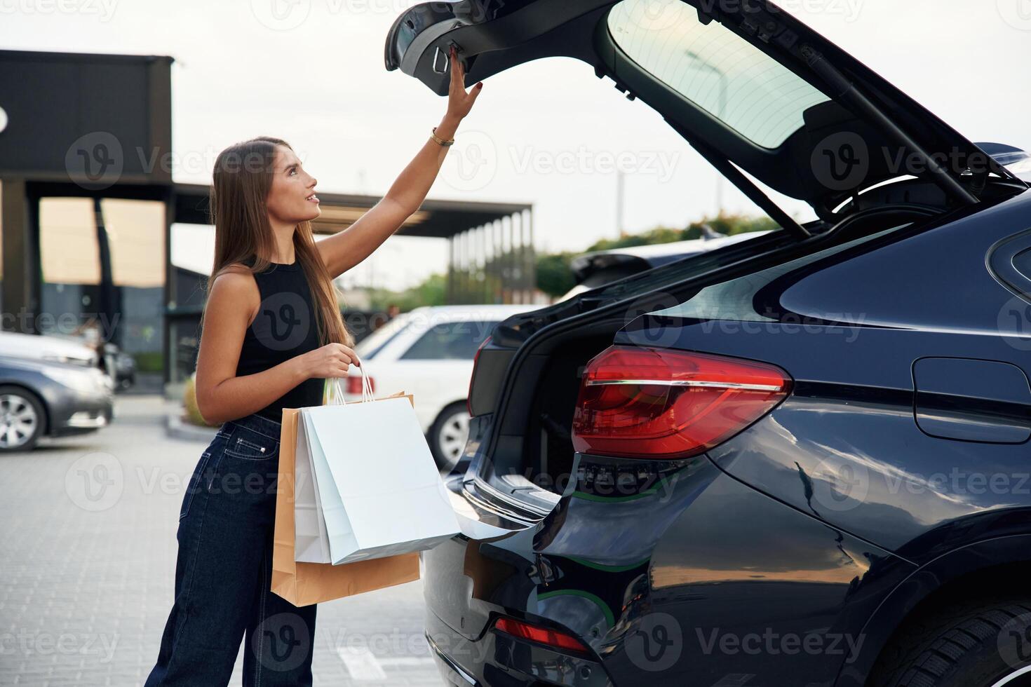 Woman, is, near her car outdoors photo