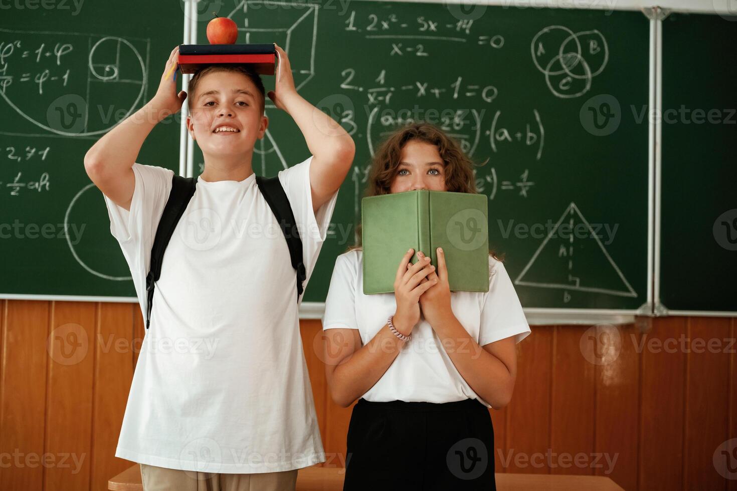 Having, fun on a break time. Pupils, kids in the classroom together photo