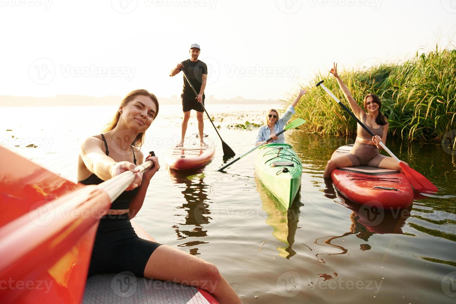 Taking ,selfie. .Friends are together on sup boards on the lake photo