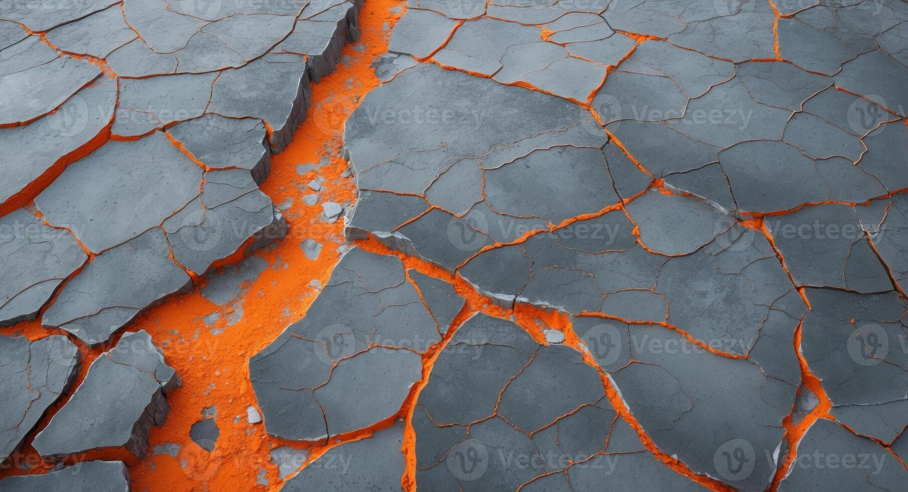 Fractured Earth. A Landscape of Cracked Gray Stone with Glowing Orange Fissures. photo