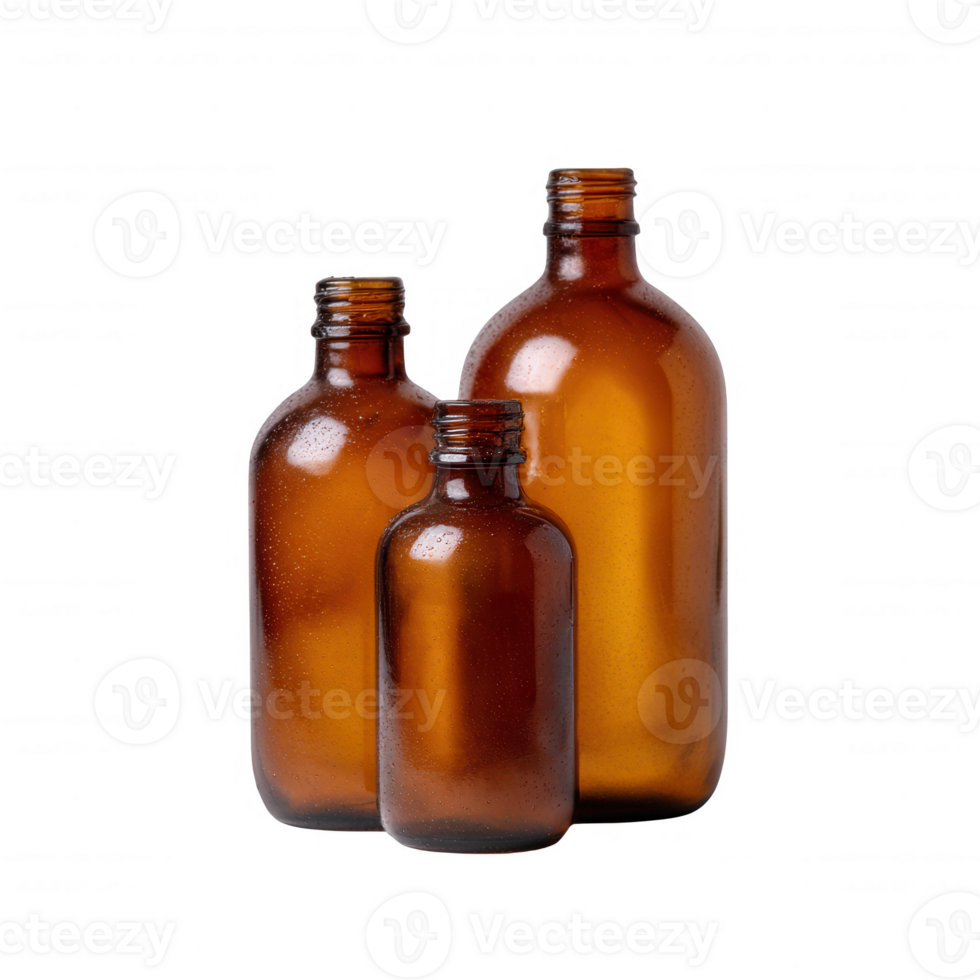 Three amber glass bottles of varying sizes arranged together, showcasing their unique shapes and muted colors, perfect for use in beverage or packaging designs. png