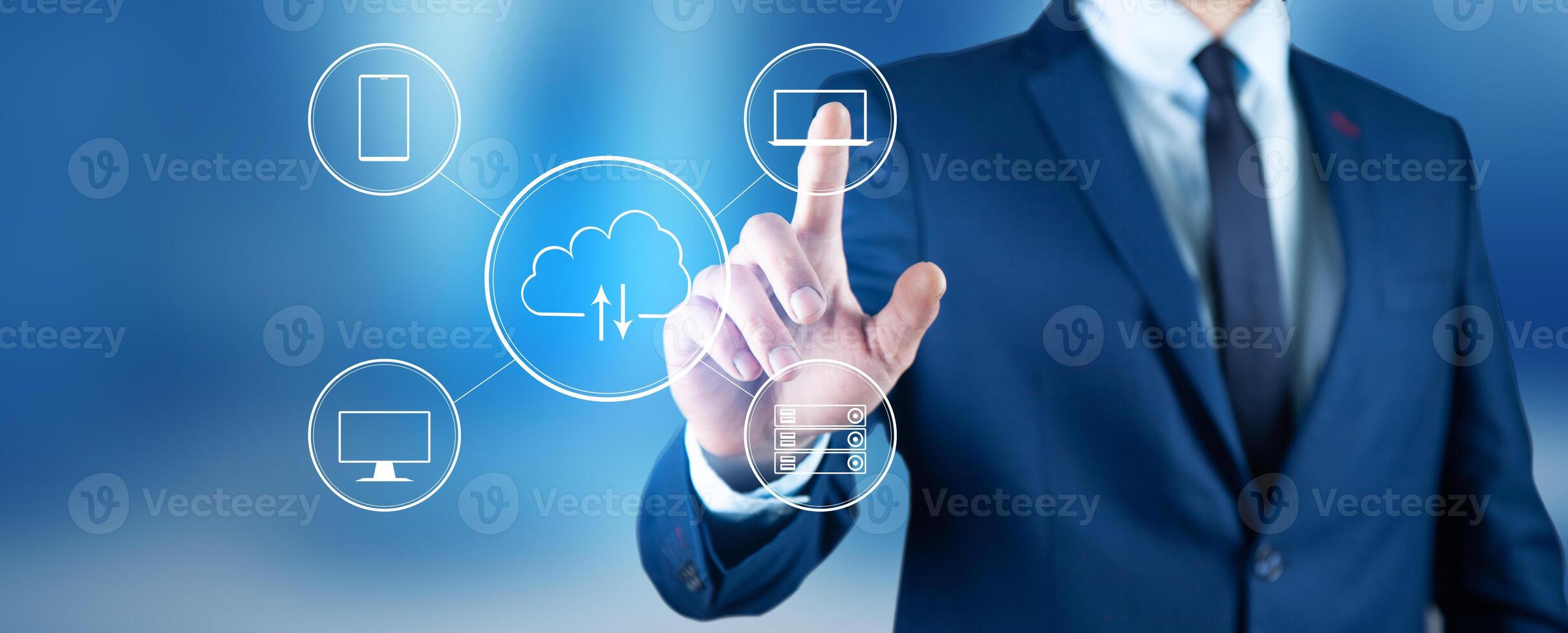 Businessman in suit touching cloud computing icons on blue background photo