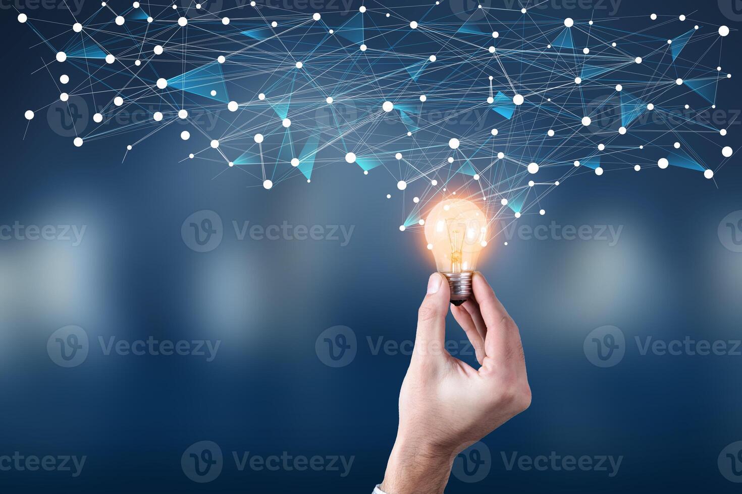 Hand holding light bulb with network connection concept photo