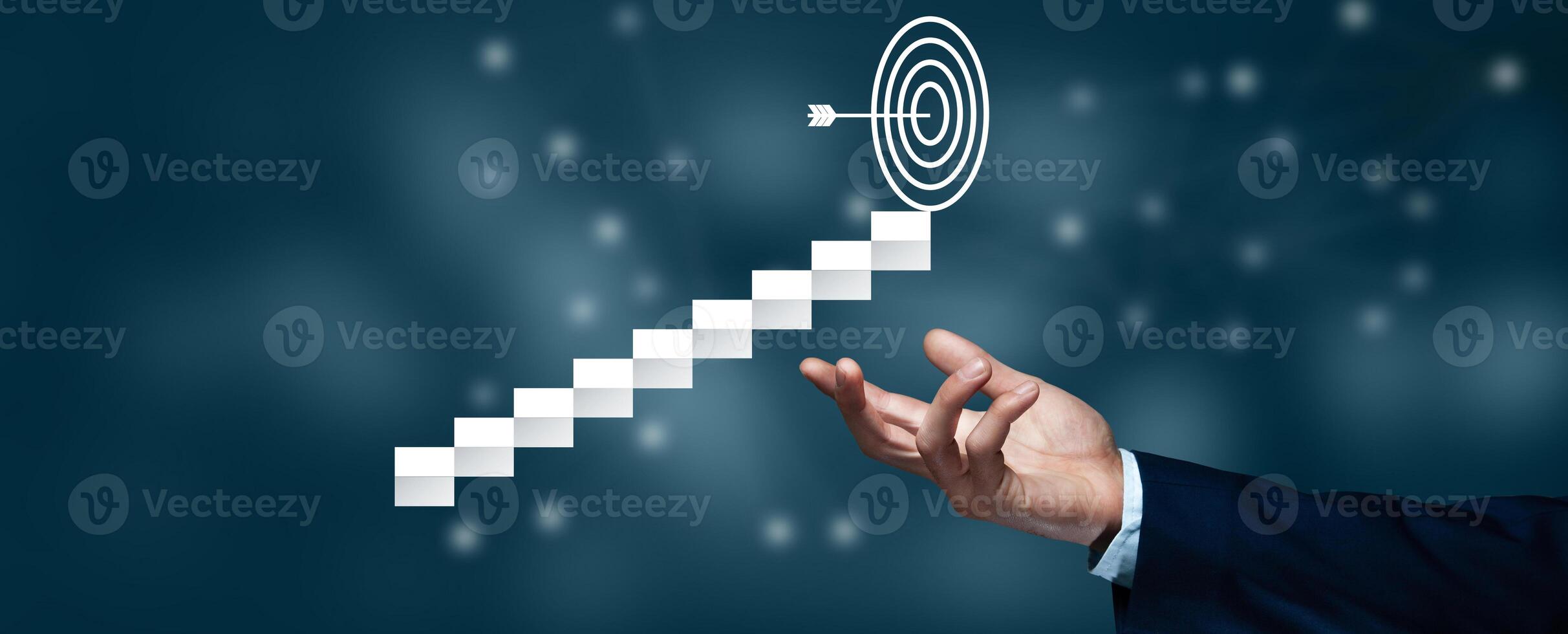 A hand is pointing to a target on a stairway photo