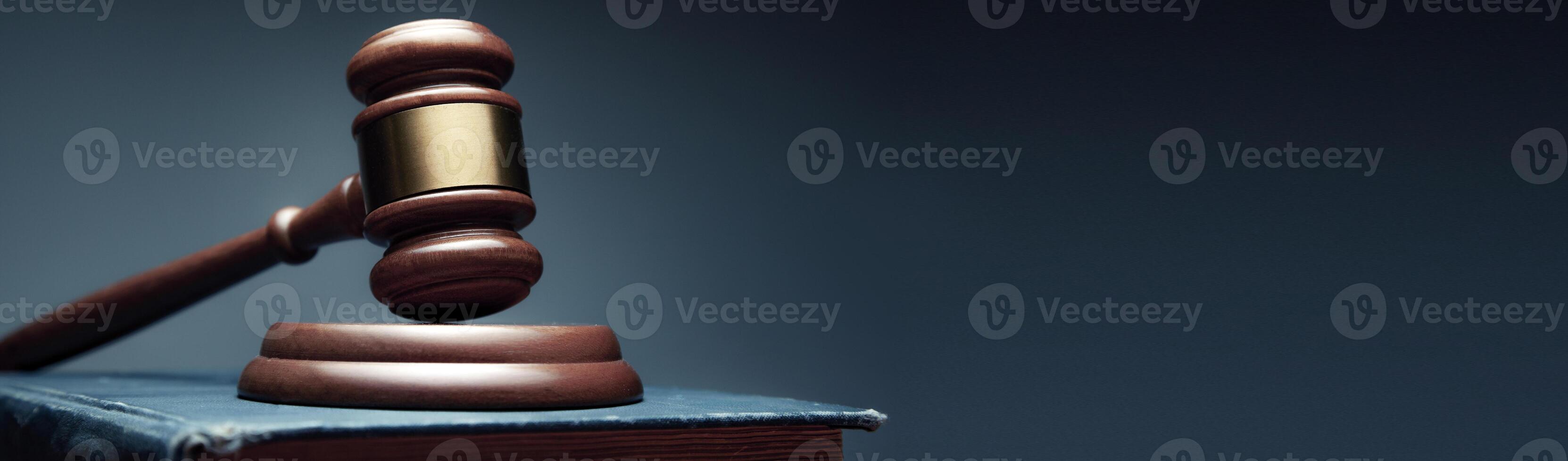 Judge's gavel on a blue book photo