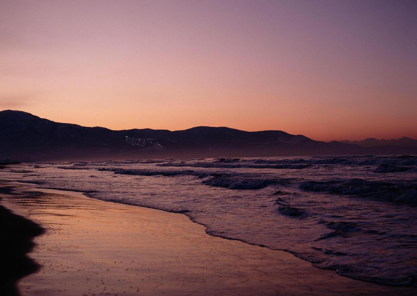 a sunset on the beach photo
