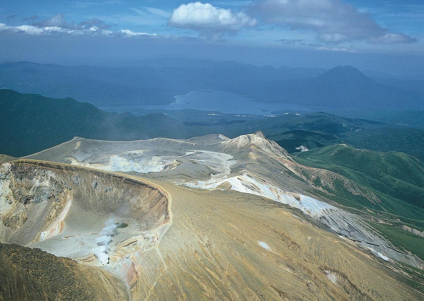 a mountain with a lake in the middle photo