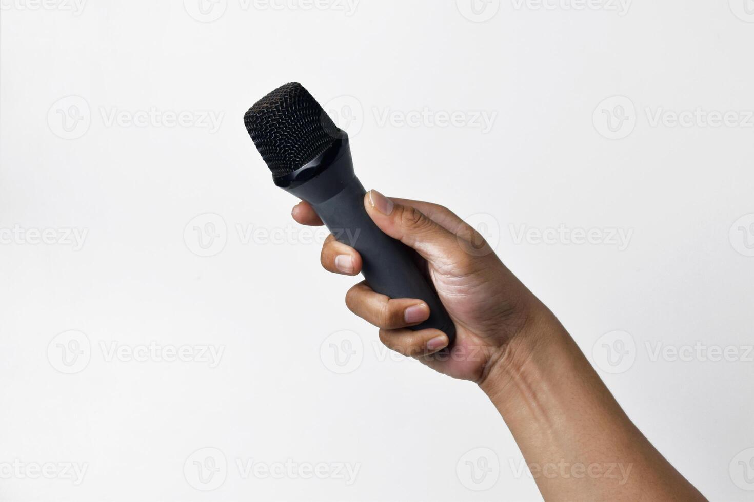 Hand Holding Microphone from Low Angle photo