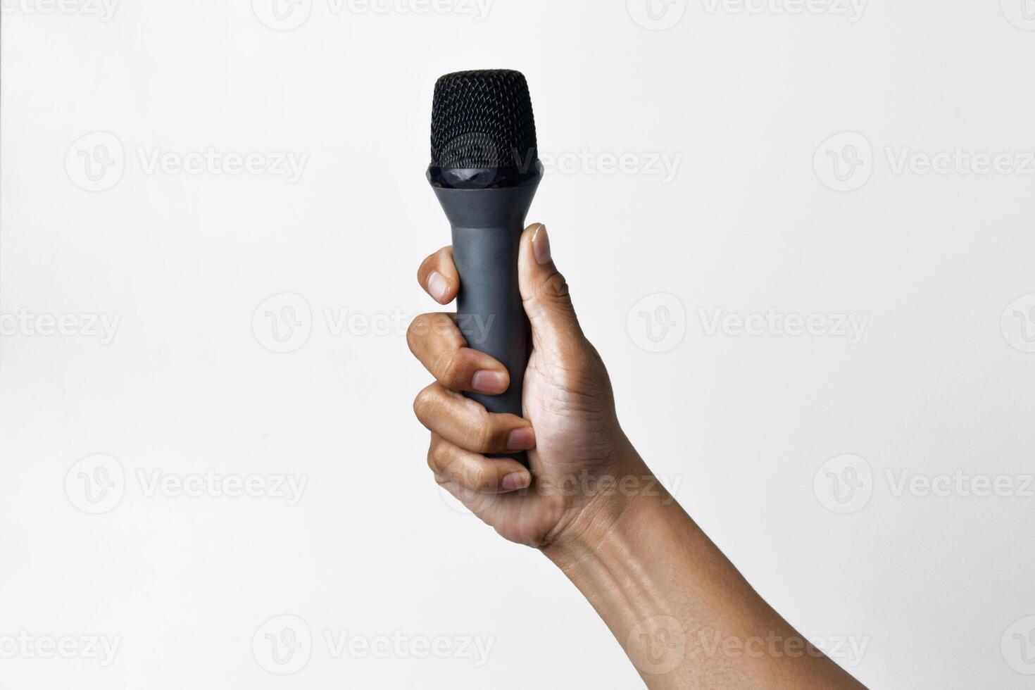 Person reaching out with microphone from below on white photo