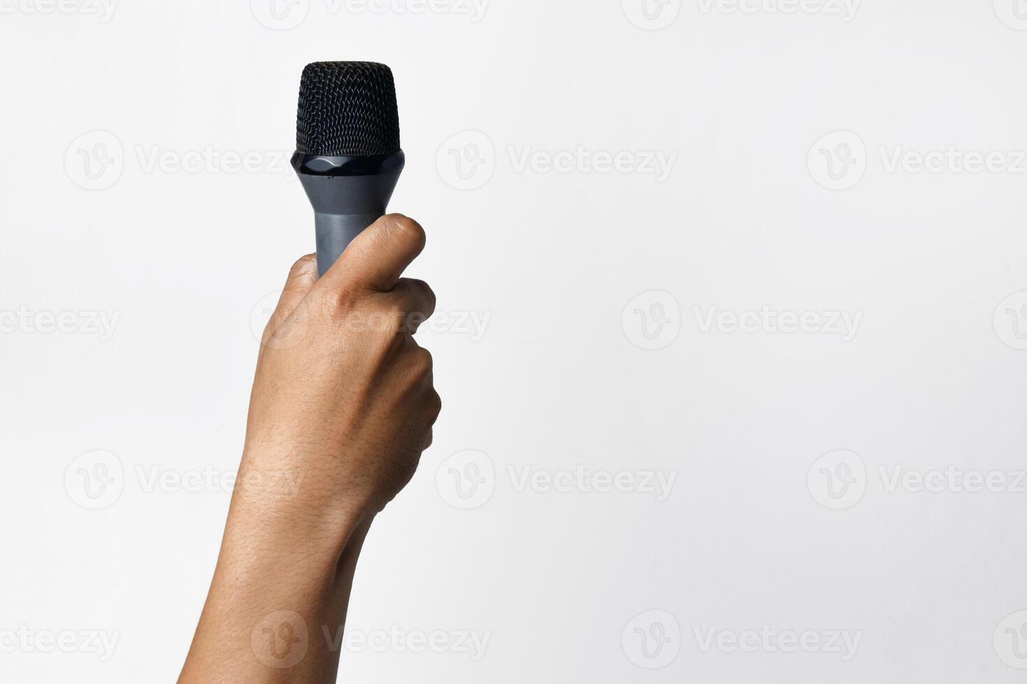 Asian hand holding microphone close up isolated photo
