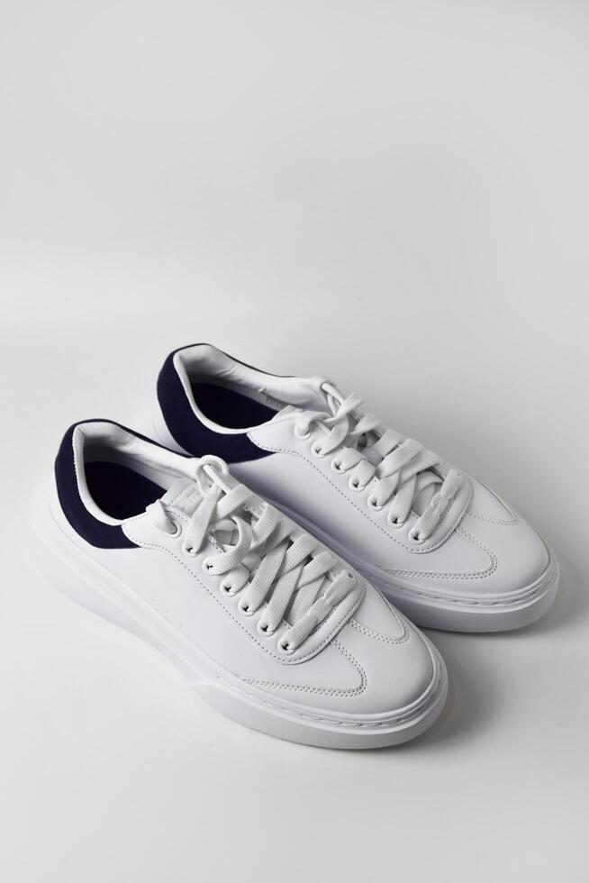 Flat lay of white athletic shoes photo