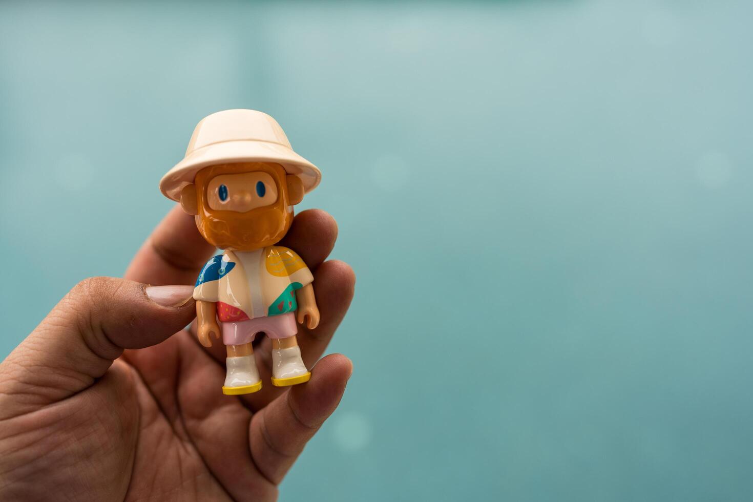 Bangkok, Thailand - June 2, 2025 A cute model of FARMER BOB, Starfish Collector. Farmer Bob Island Series by Finding Unicorn. on hand photo