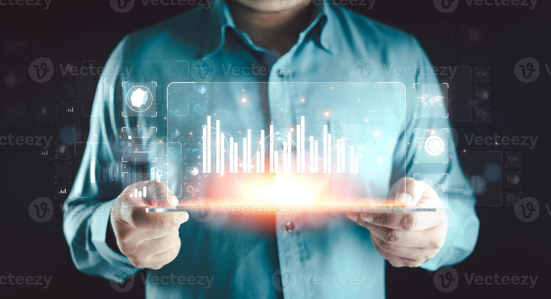 Businessman or analyst working with business analytics and data management system on virtual screen. photo