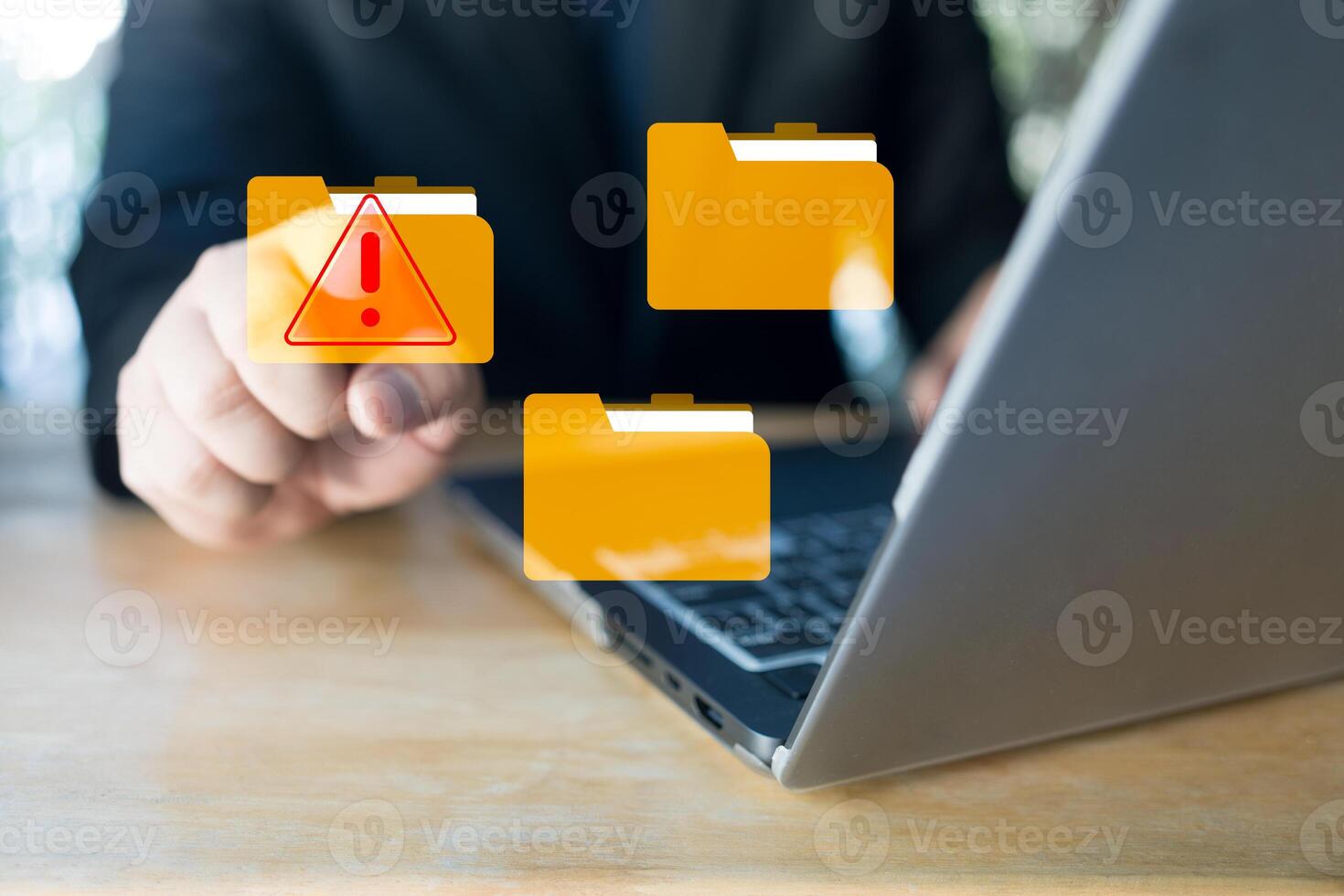 Hand touch a virtual folder with alert symbol. Cyberattacks on computer networks. photo
