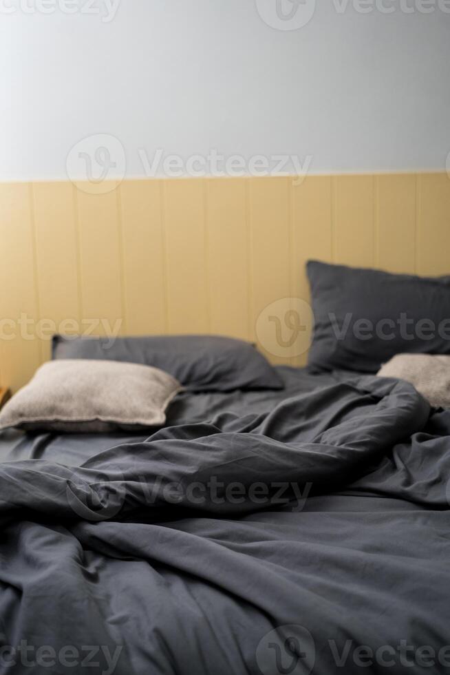 Textile texture of blue cloth view of bedroom and blanket bed sheet after use with wrinkle waiting for bed maid photo