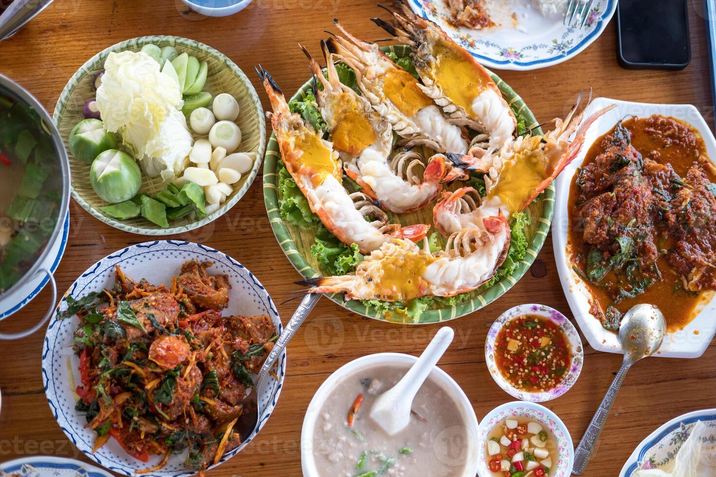 A variety of Thai seafood freshly served dishes in the restaurant photo