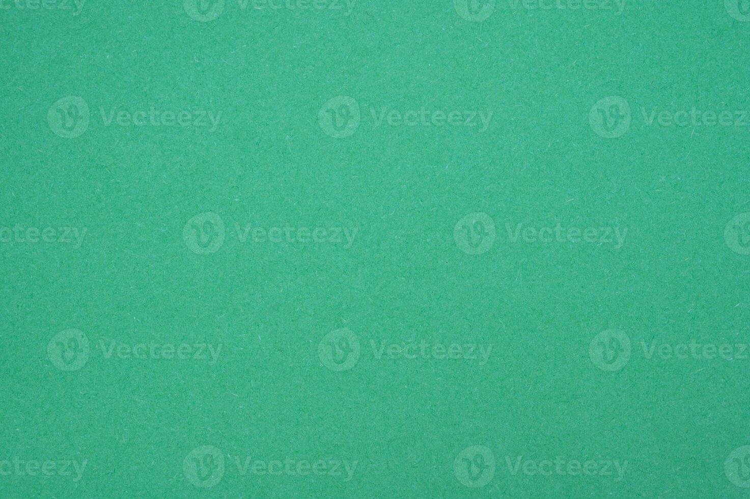 The surface of light green paper sheet texture and background. photo