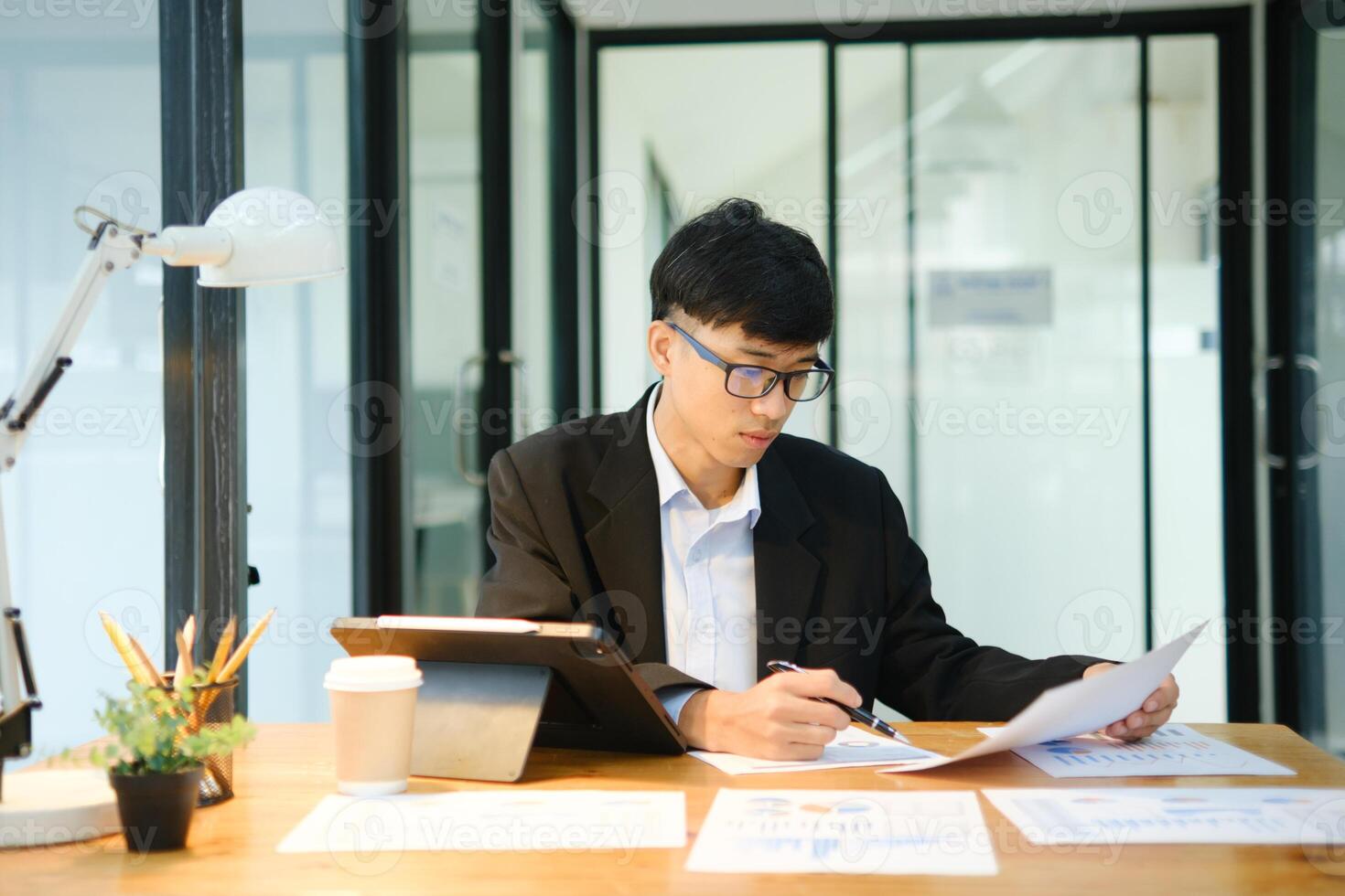 Businessman is working at office analyse data photo