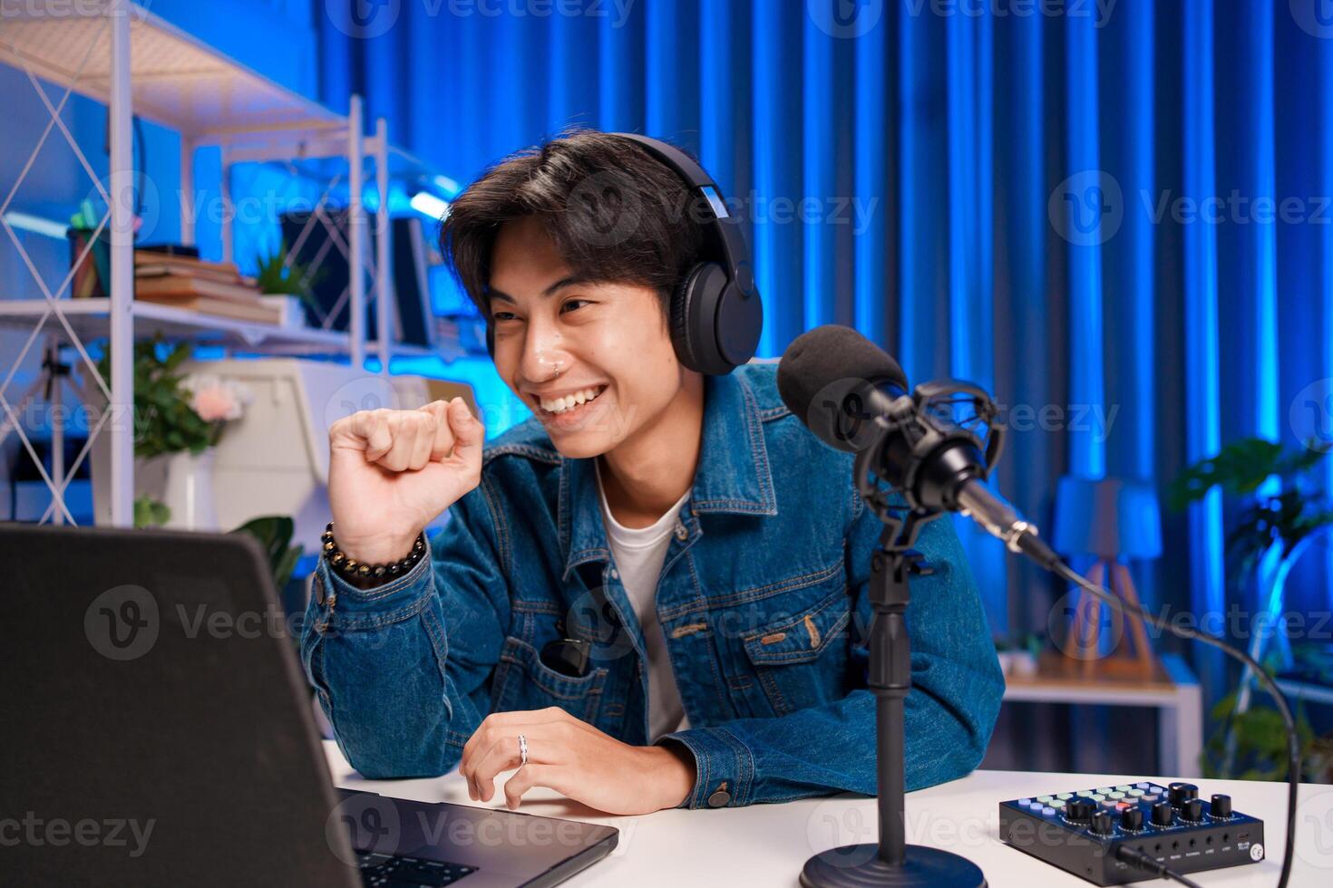 Podcast presenter smiling while engaging with viewers photo