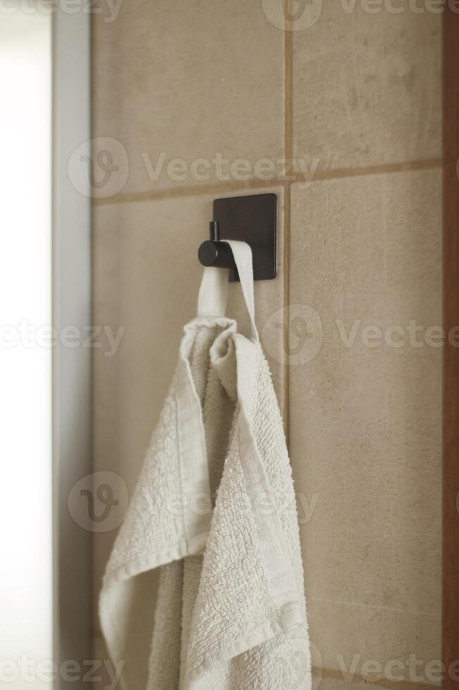 Face towel in black hook photo