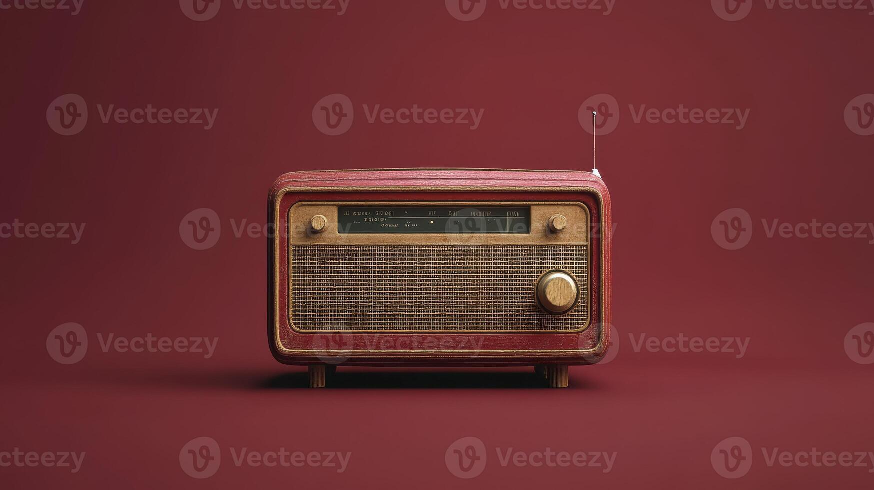 A Vintage Radio on a Burgundy Background Perfect for Retro-Themed Projects photo