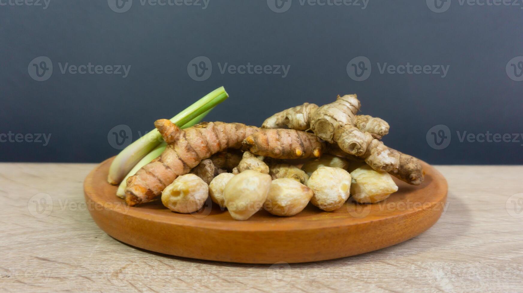 Turmeric, ginger, lemongrass, and candlenuts photo
