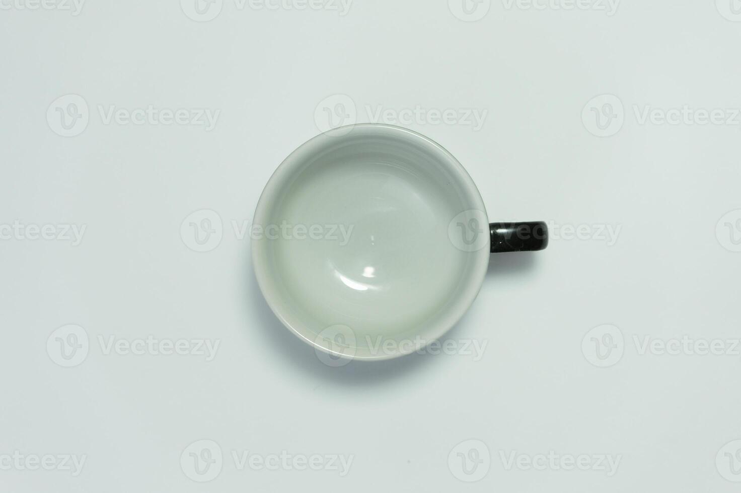 Empty ceramic cup isolated on white background photo