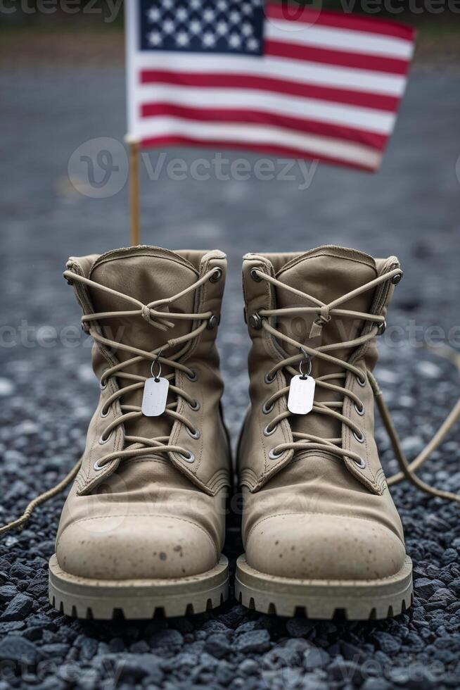 Patriotic scene of worn military boots and flag on gravel, honoring soldiers with symbolic remembrance for Memorial Day photo