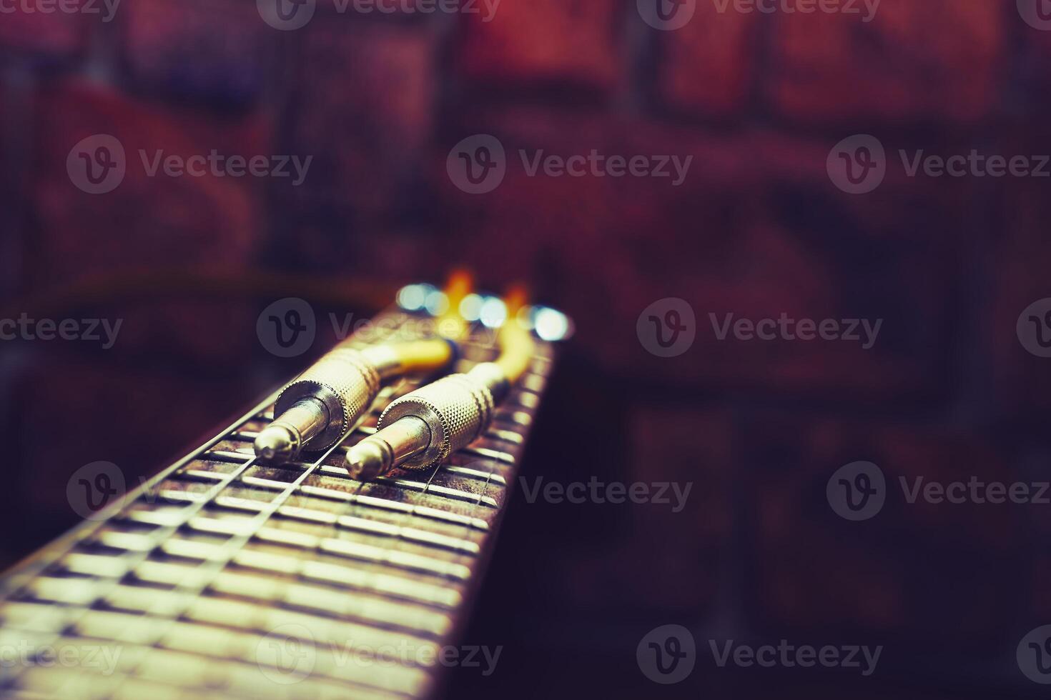 Cord with jacks for connection on fingerboard electric guitar photo