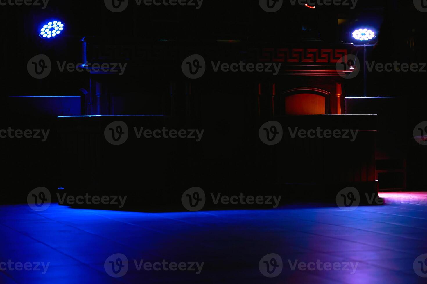 Evening relax.Dark empty dance floor in light of spotlights in nightclub photo