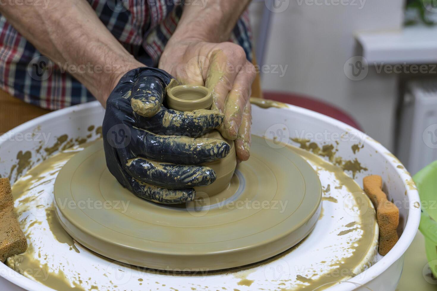 Learning Pottery Creating a Clay Bowl on the Wheel photo