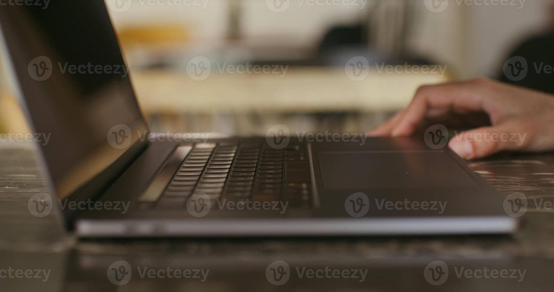 Man opens the lid of the laptop and begins to type text, entering the password to enter the system. Male hands close up, no face photo