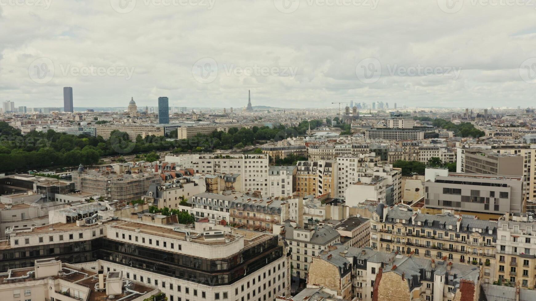 Horizontal panning from a drone, a general view of the historic center of Paris. The Elfel Tower rises above the buildings. France Paris historic photo
