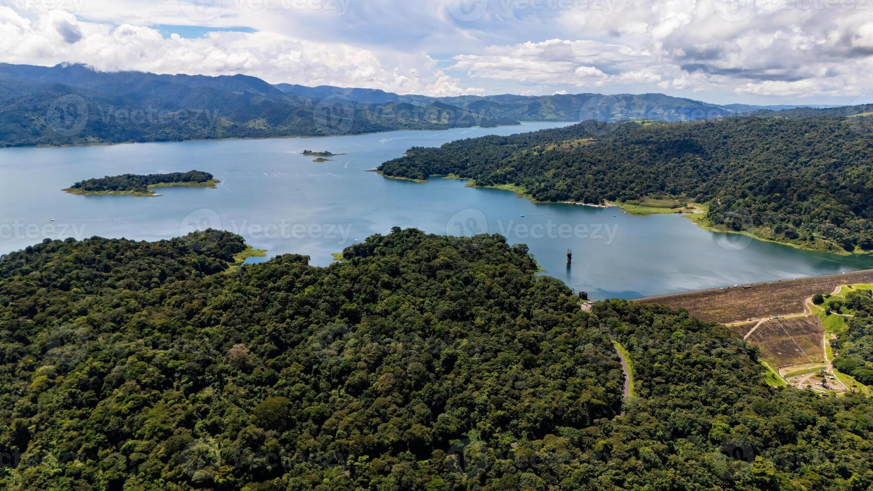 A part of Lake Arenal covering a town photo