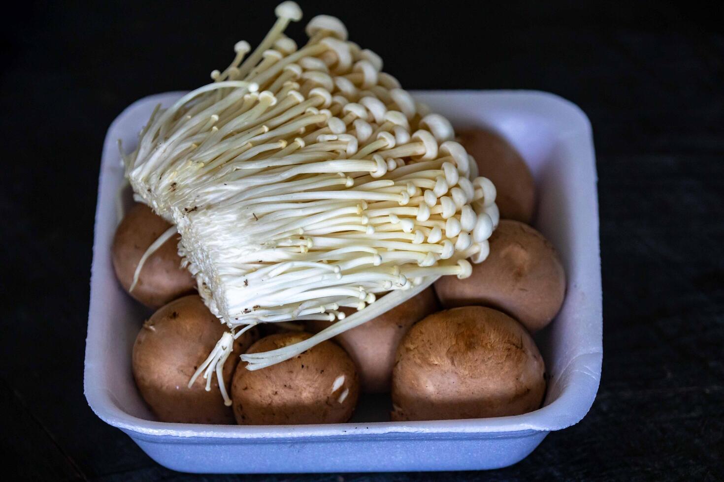 known as Enokitake, the Enoki mushroom Flammulina velutipes, is a variety widely used in oriental cuisine destac photo