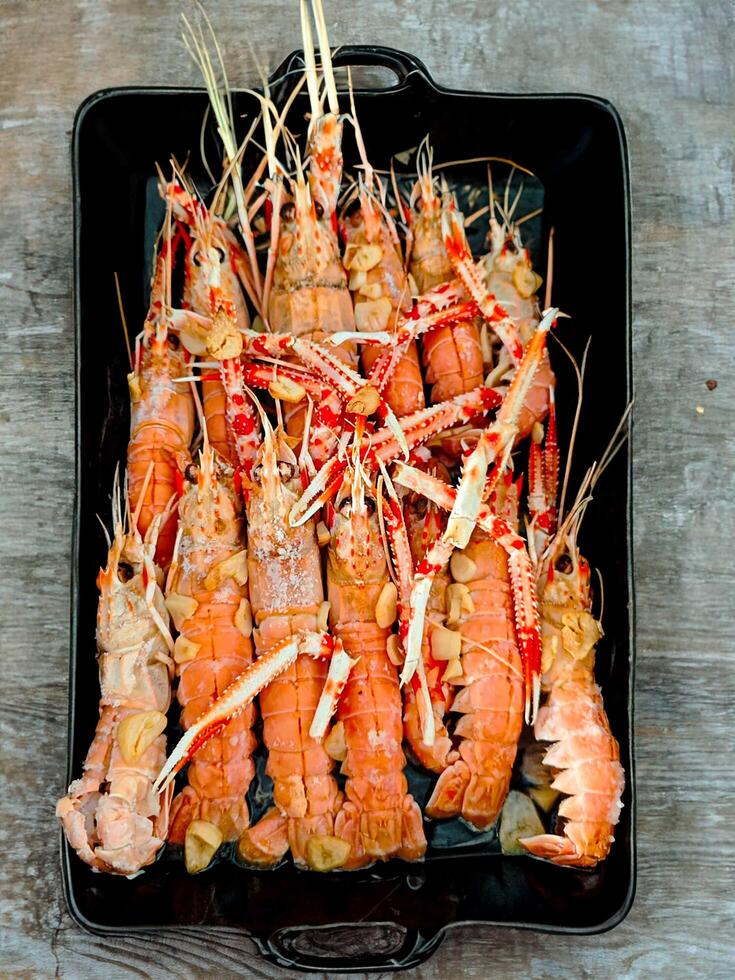 Brazilian Fresh crayfish roasted using the rustic method photo